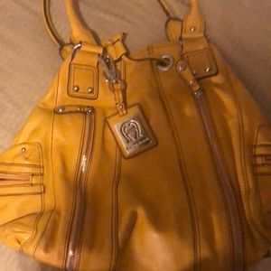 Etienne Aigner purse color- yellow (mustard)
